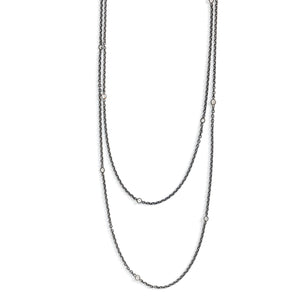 This long Victorian gunmetal chain measures 60" in length and features 18 incredibly cut glass stones. Doubled up on a spring ring clasp, it is nearly 30" in length and is unique on its own or pairs perfectly with one of our vintage lockets or pendants. Close up view showing stones
