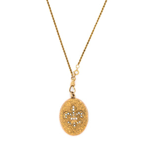Oval Pearl Fleur De Lis Antique Locket, beautiful gold fill and pearl locket, perfect for holding pictures and photos, front view, shown on antique gold fill rope watch chain