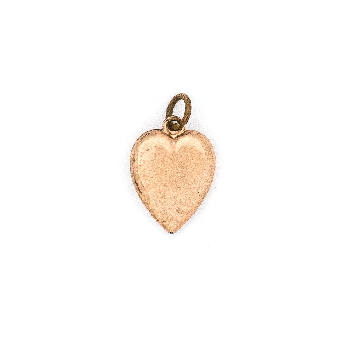 This petite heart shaped Victorian charm features a delicately etched starburst with a seed pearl at it's center. This classic charms pairs perfectly with one of our antique chains. Back charm view
