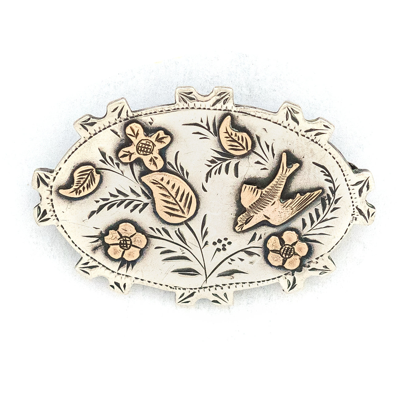 This stunning Victorian era pin is made of English sterling silver with 14K gold accents. It features classic Victorian symbols such as a swallow and forget-me-not flowers among other greenery. It is hallmarked for Birmingham, 1896. This beautiful artifact from the Victorian era will surely become an heirloom for a new generation. Front view of pin