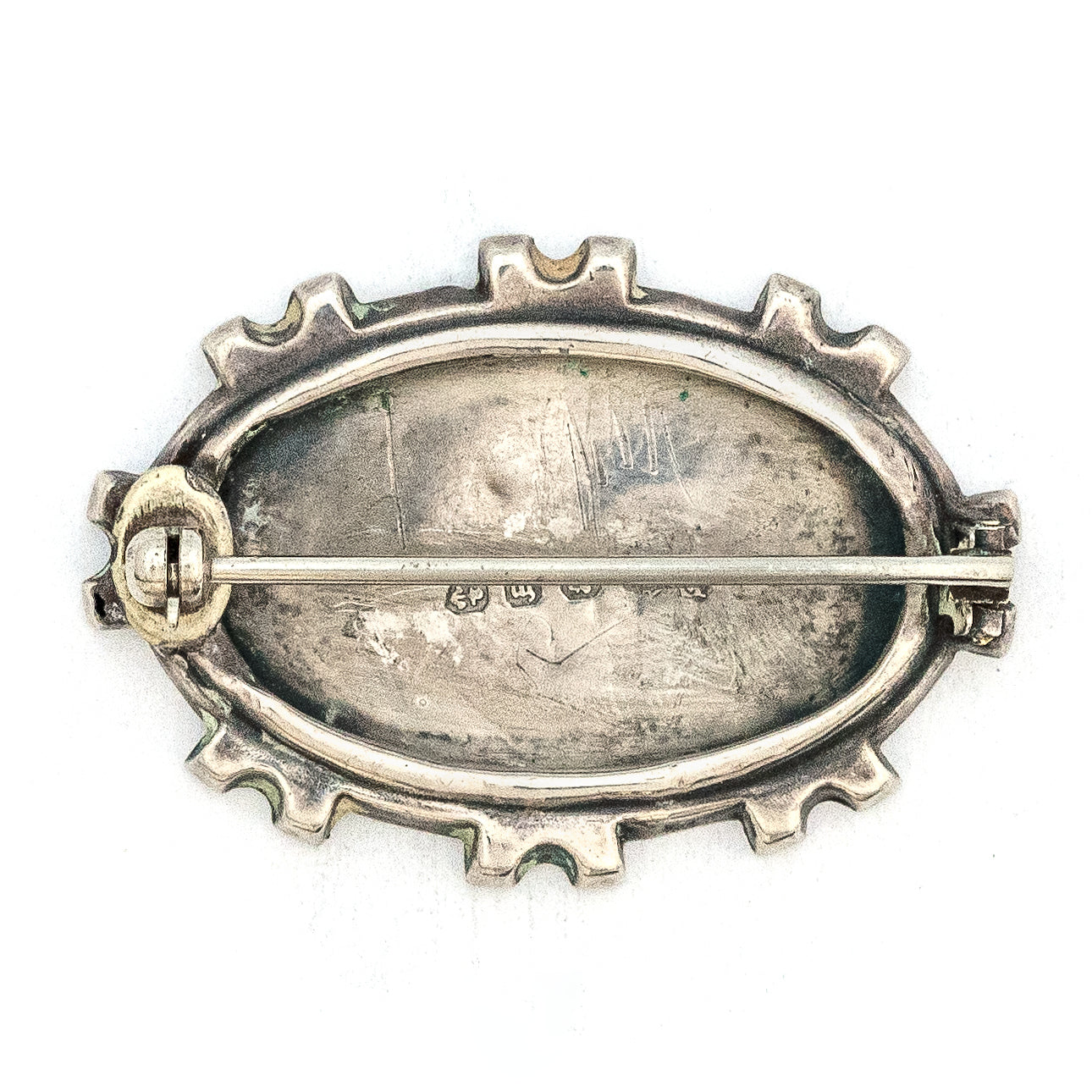 This stunning Victorian era pin is made of English sterling silver with 14K gold accents. It features classic Victorian symbols such as a swallow and forget-me-not flowers among other greenery. It is hallmarked for Birmingham, 1896. This beautiful artifact from the Victorian era will surely become an heirloom for a new generation. Front view of pin