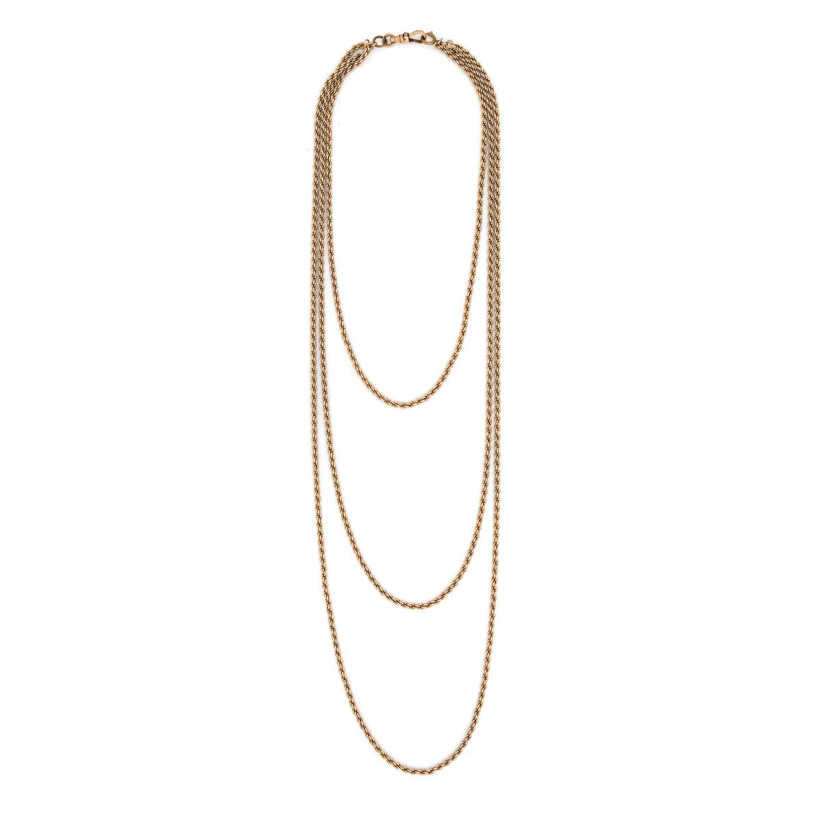 This 12K gold fill antique rope chain features three gorgeous strands of varying lengths (18", 27" and 34")  which meet together at the back with a hefty watch chain hook. Wear this striking piece alone or layered with your favorite pieces for a bold statement. Full chain view