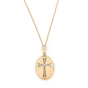 This oval locket features a white paste stone encrusted cross with a pinstripe backdrop. The letter EM are inscribed on the back. It opens to hold two photos, includes one original frame and pairs perfectly with one of our antique gold fill chains.  Front Locket View, shown on chain