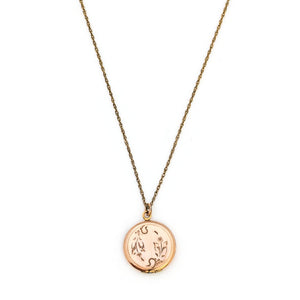 This petite round locket features a playful daisy pattern and a finely etched zigzag design around the border. It opens to hold two photos and pairs perfectly with one of our antique gold fill chains.  Front Locket View, Shown on Chain