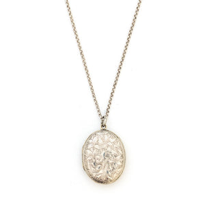 This sterling silver oval locket features a detailed garden vine pattern that covers the entire face of the locket. It opens to hold two photos, includes both original frames and pairs perfectly with one of our vintage sterling silver chains.  Front Locket View, Shown on chain