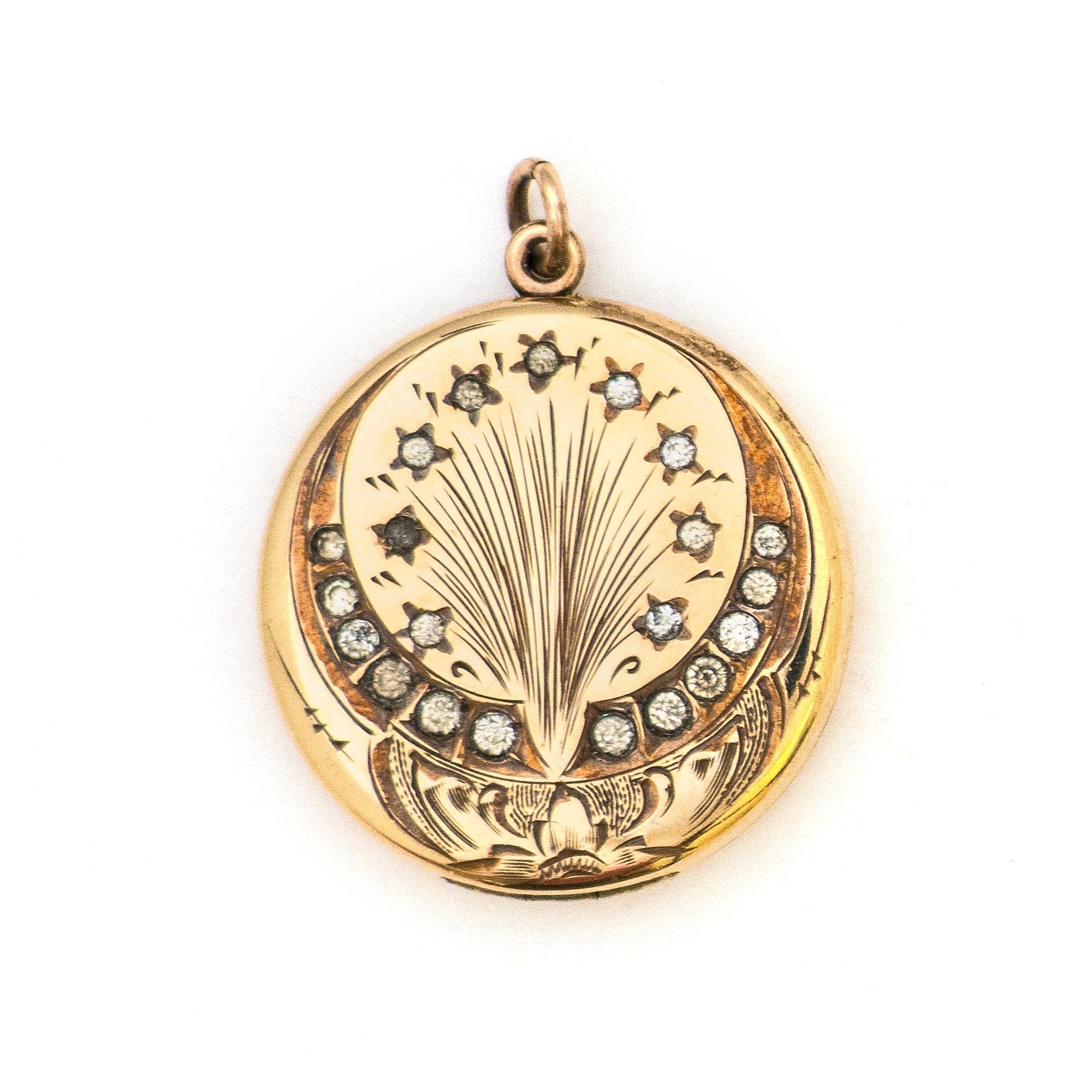 This spirited round locket features an explosive fireworks design enhanced by 21 white Victorian paste stones. It opens to hold two photos, includes both original frames and pairs perfectly with one of our antique gold fill chains.  Front Locket View