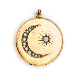 This large round locket features a pearl encrusted crescent moon and a starburst with a 4 mm opal at the center. It opens to hold two photos and pairs perfectly with one of our antique gold fill chains.  Front Locket View