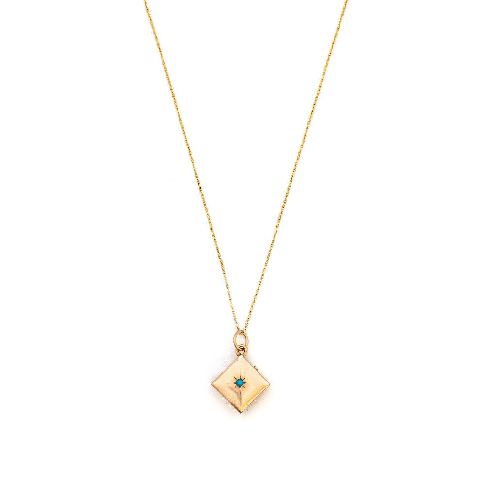 This square 10K gold locket features a simple Victorian starburst with turquoise at it's center and the letter G is inscribed on the back. It opens to hold two photos and pairs perfectly with one of our antique 14K gold chains.  Front Locket View, Shown on chain