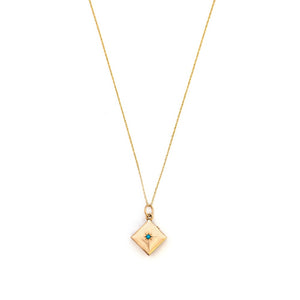 This square 10K gold locket features a simple Victorian starburst with turquoise at it's center and the letter G is inscribed on the back. It opens to hold two photos and pairs perfectly with one of our antique 14K gold chains.  Front Locket View, Shown on chain