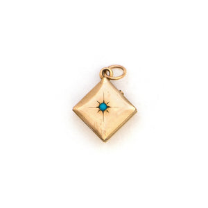 This square 10K gold locket features a simple Victorian starburst with turquoise at it's center and the letter G is inscribed on the back. It opens to hold two photos and pairs perfectly with one of our antique 14K gold chains.  Front Locket View