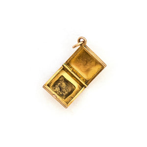 This square 10K gold locket features a simple Victorian starburst with turquoise at it's center and the letter G is inscribed on the back. It opens to hold two photos and pairs perfectly with one of our antique 14K gold chains.  Open Locket View