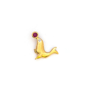 This playful seal charm is made of 10K Gold and features a genuine ruby as the ball on the tip of the seals nose and a diamond as the seal's eye. Paired with one of our antique 14K gold chains, this fun charm can be worn both alone as a pendant or in a cluster of charms. Front charm view
