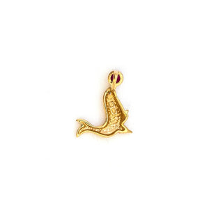 This playful seal charm is made of 10K Gold and features a genuine ruby as the ball on the tip of the seals nose and a diamond as the seal's eye. Paired with one of our antique 14K gold chains, this fun charm can be worn both alone as a pendant or in a cluster of charms. Back charm view