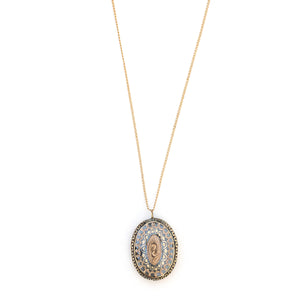 This unusual 10K gold oval locket features extremely intricate Niello technique with use of both yellow and rose gold and silver, a truly unique piece! It opens to hold two photos, includes both original frames and pairs perfectly with one of our antique 14K gold chains. Front locket view, shown on chain