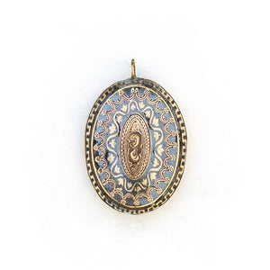 This unusual 10K gold oval locket features extremely intricate Niello technique with use of both yellow and rose gold and silver, a truly unique piece! It opens to hold two photos, includes both original frames and pairs perfectly with one of our antique 14K gold chains.  Front locket view
