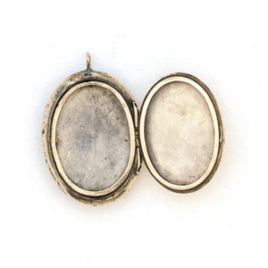 This unusual 10K gold oval locket features extremely intricate Niello technique with use of both yellow and rose gold and silver, a truly unique piece! It opens to hold two photos, includes both original frames and pairs perfectly with one of our antique 14K gold chains.  Open locket view