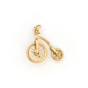 This English bicycle charm is made of 9K Gold. If features working wheels that spin, and an extreme attention to detail. The English gold hallmarks let us know that it was made in London in 1979 by A & Co. Paired with one of our antique 14K gold chains, this fun charm can be worn both alone as a pendant or in a cluster of charms. Back of charm view