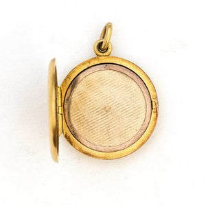 This breathtaking 14K gold locket features a woman in raised relief with her hair swirling around the lockets perimeter and a Victorian starburst with a 3 point diamond at its center. The initials MN are elegantly inscribed on the back. It opens to hold two photos, includes both original frames and pairs perfectly with one of our antique 14K gold chains. Open Locket view