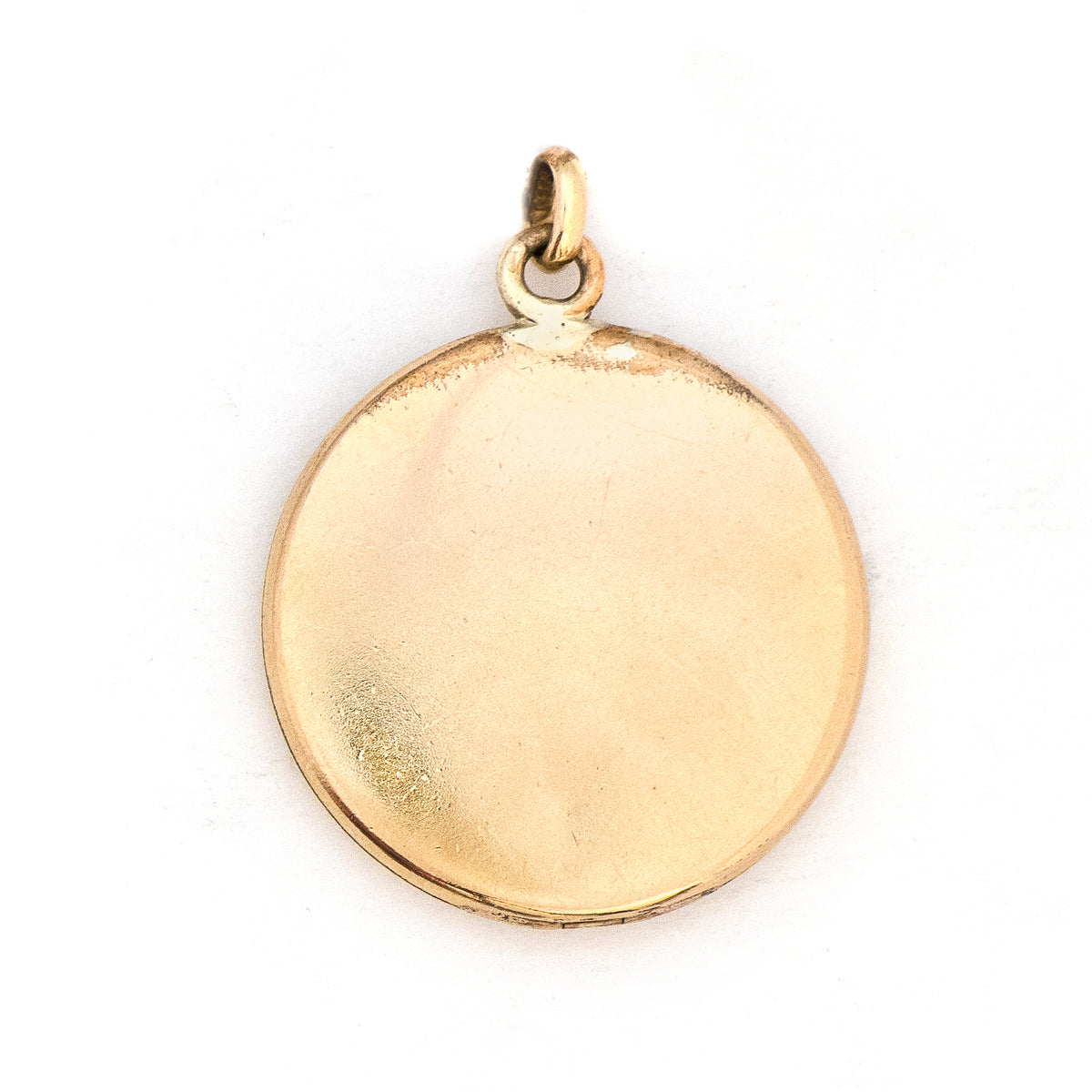 This striking round locket features an opal at it's center with intricate multi layered details and white paste stones radiating out in a sun-like pattern. It opens to hold two photos and pairs perfectly with one of our antique gold fill chains, back locket view