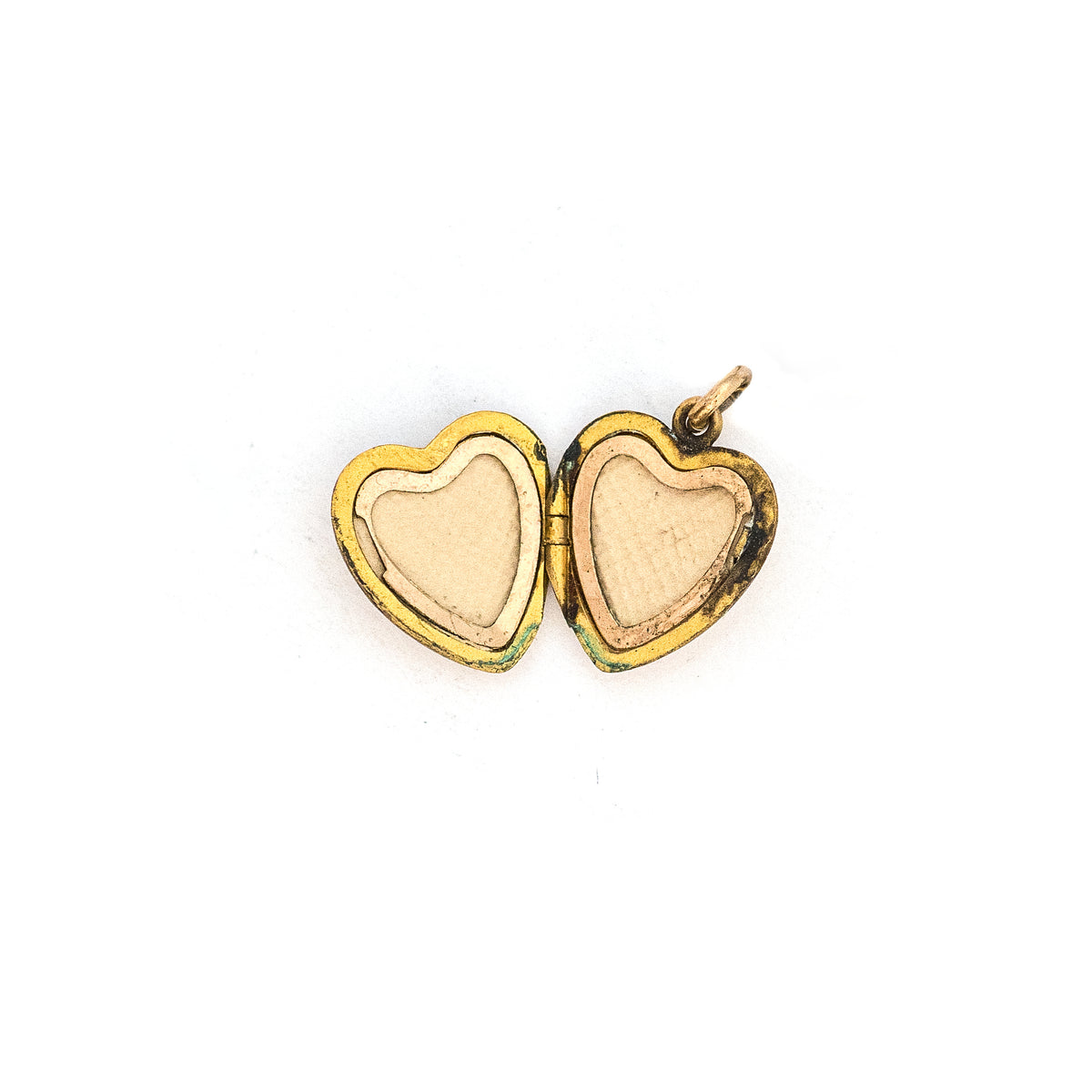 This petite heart shaped locket features a classic Victorian starburst with turquoise at it's center. It opens to hold two photos, includes both original frames and pairs perfectly with one of our antique gold fill chains.  Open locket view