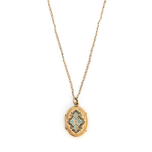This oval locket features a gorgeous light blue and black enamel design with a finely textured background. It opens to hold two photos and pairs perfectly with one of our antique gold fill chains.  Front Locket View, shown with chain