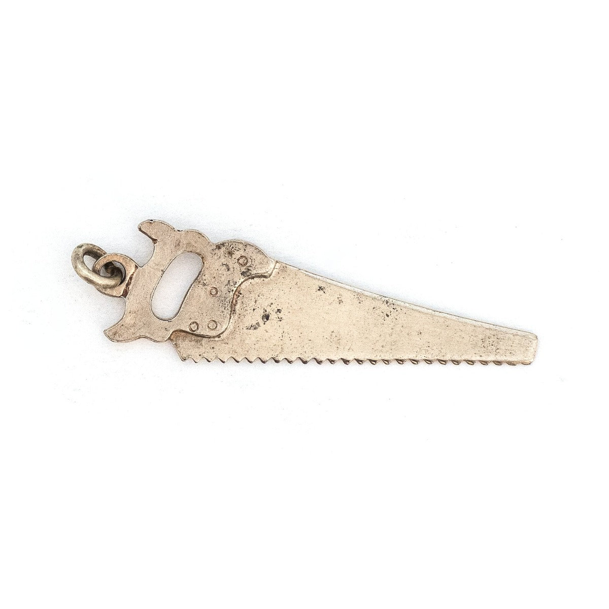 This unique saw charm is made of sterling silver and features intricate realistic details and the E.C. ATKINS & Co. Maker Mark, a prominent saw manufacturer out of Cleveland, OH, established in 1855. Paired with one of our antique silver chains, this saw charm can be worn both as a pendant or in a cluster of charms. Back chain view