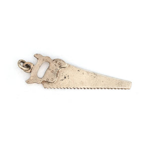 This unique saw charm is made of sterling silver and features intricate realistic details and the E.C. ATKINS & Co. Maker Mark, a prominent saw manufacturer out of Cleveland, OH, established in 1855. Paired with one of our antique silver chains, this saw charm can be worn both as a pendant or in a cluster of charms. Back chain view