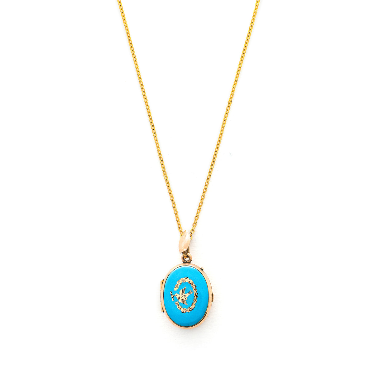 This absolutely gorgeous robin egg blue enamel and gold fill locket is oval shaped and features a sparrow carrying a scroll in it's beak. The sparrow is surrounded by an intricate golden wreath. It opens to hold two photos, includes both original frames and glass, and pairs perfectly with one of our antique gold fill chains.  Front Locket View, shown on chain
