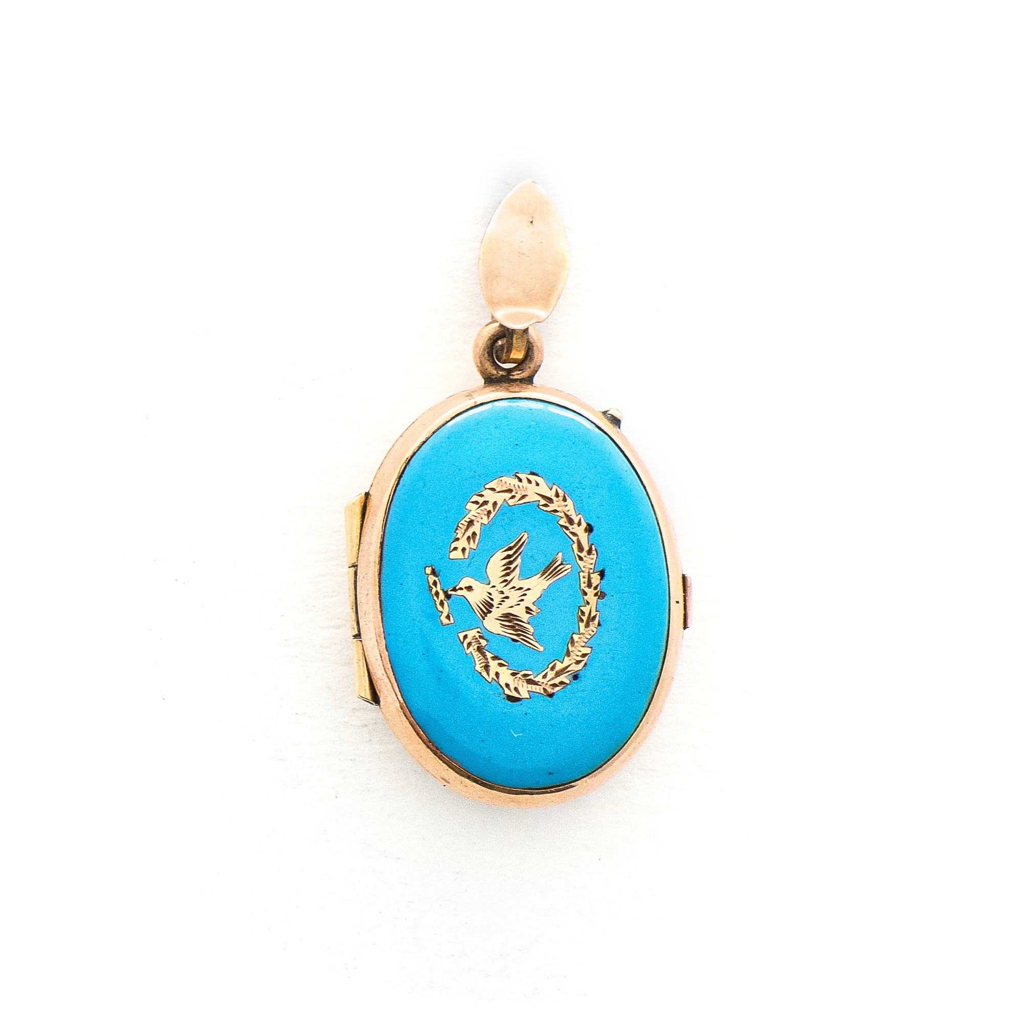 This absolutely gorgeous robin egg blue enamel and gold fill locket is oval shaped and features a sparrow carrying a scroll in it's beak. The sparrow is surrounded by an intricate golden wreath. It opens to hold two photos, includes both original frames and glass, and pairs perfectly with one of our antique gold fill chains.  Front Locket View