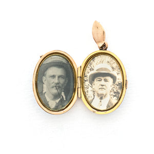 This absolutely gorgeous robin egg blue enamel and gold fill locket is oval shaped and features a sparrow carrying a scroll in it's beak. The sparrow is surrounded by an intricate golden wreath. It opens to hold two photos, includes both original frames and glass, and pairs perfectly with one of our antique gold fill chains.  Open locket view