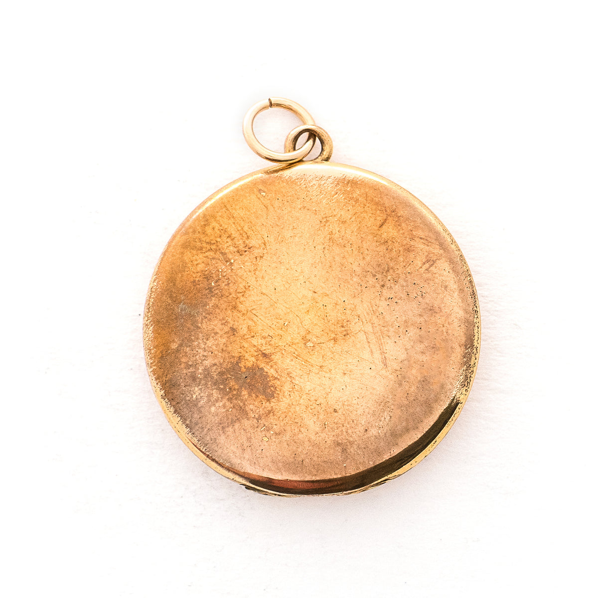 This classic Victorian locket features a large crescent moon surrounding a bright starburst with 10 white Victorian paste stones throughout the design. It opens to hold two photos, includes one original frame and pairs perfectly with one of our antique gold fill chains.  Back locket view