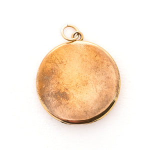 This classic Victorian locket features a large crescent moon surrounding a bright starburst with 10 white Victorian paste stones throughout the design. It opens to hold two photos, includes one original frame and pairs perfectly with one of our antique gold fill chains.  Back locket view