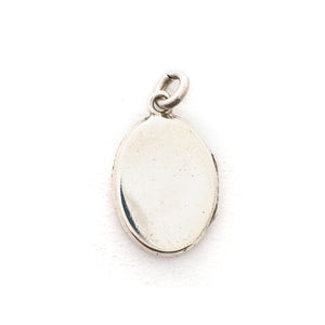 This oval sterling silver locket features two beautiful plumes with tiny flowers at it's base. It opens to hold two photos and pairs perfectly with one of our vintage sterling silver chains. Back locket view