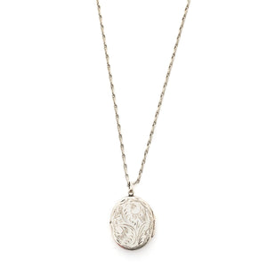 This oval sterling silver locket features a whimsical paisley pattern across the front and half of the back. It opens to hold two photos and pairs perfectly with one of our vintage sterling silver chains. Front Locket View shown on chain