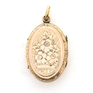 This striking oval locket features classic Victorian era symbolism with a pair of swallows surrounded by forget-me-not flowers enhanced with blue, white and green enamel throughout the design. It opens to hold two photos and pairs perfectly with one of our antique gold fill chains.  Back Locket View