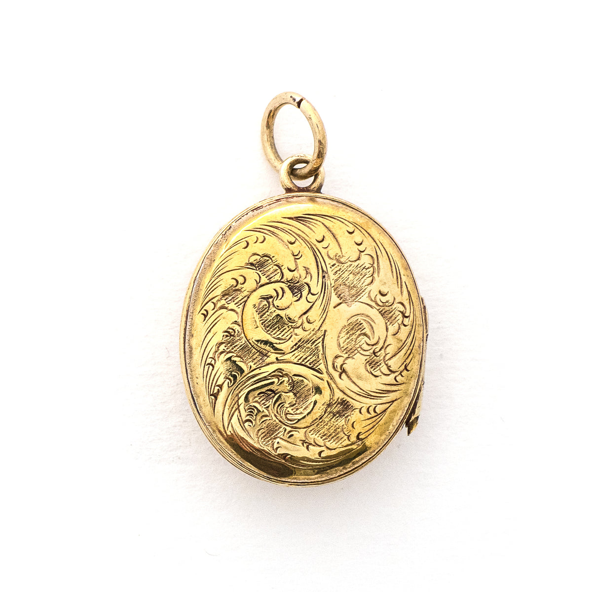 This gorgeous oval locket features periwinkle blue enamel as the backdrop to a climbing golden vine. It opens to hold two photos and pairs perfectly with one of our antique gold fill chains. Back of Locket View