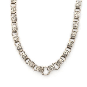 This statement making sterling silver antique book chain features finely engraved oval links, a treasure from the Victorian era. Wear this piece alone, with charms or a locket, or layered with other chains for a bold statement. Close up view