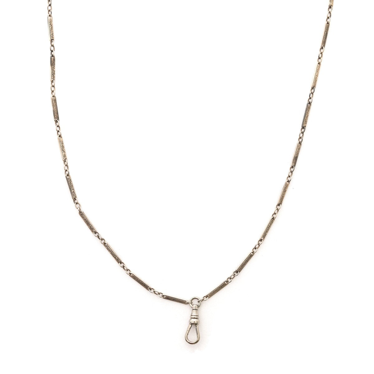 This classic sterling silver vintage bar link watch chain features silver bars that are beautifully engraved with curlicues and flourishes, on the front and back of each bar link. At 32", it pairs perfectly with one of our antique sterling silver or niello lockets. Close up view