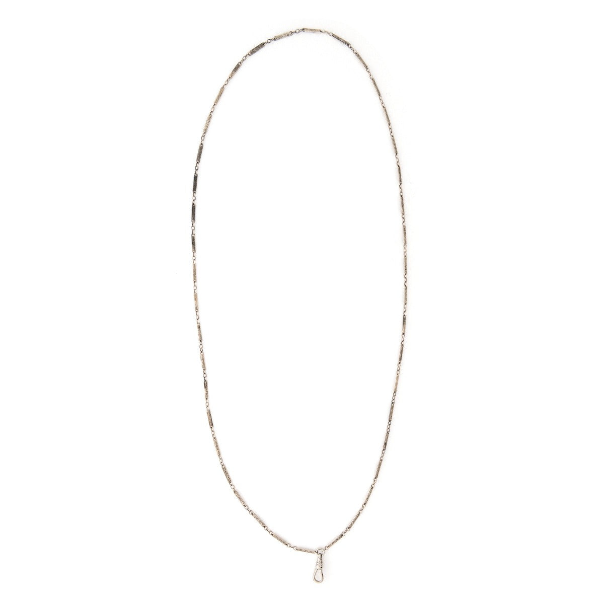 This classic sterling silver vintage bar link watch chain features silver bars that are beautifully engraved with curlicues and flourishes, on the front and back of each bar link. At 32", it pairs perfectly with one of our antique sterling silver or niello lockets. Close up view