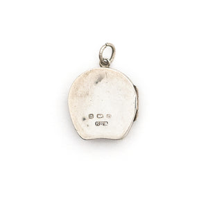 This horseshoe-shaped oval English sterling silver locket features two star flowers and one leaf in raised relief with delicately etched stems and leaves in the background. It has been hallmarked for Birmingham, 1901, opens to hold two photos and pairs perfectly with one of our vintage sterling silver chains. Back locket view