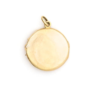 This beautifully simple 14K gold locket features a 10 point genuine diamond at its center. It opens to hold one photo, includes one original frame and pairs perfectly with one of our antique 14K gold chains.  Back locket view