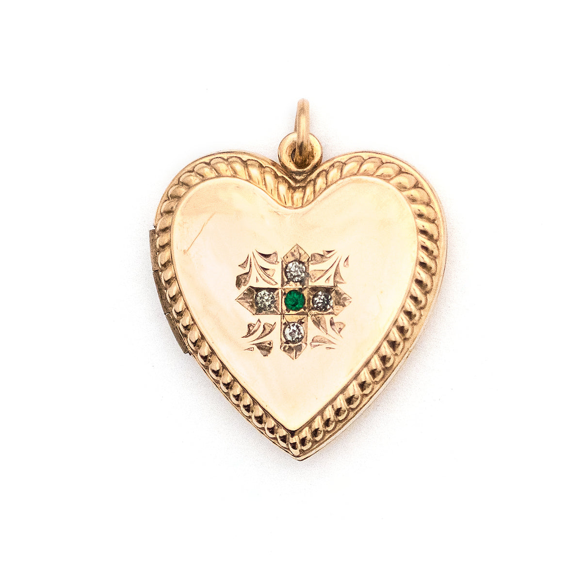 This sweet heart-shaped locket features white and green paste stones set in an equal-sided Greek cross at its center, surrounded by a charming rope border. In antiquity, the equal arms of a Greek cross symbolized the four main elements of nature: air, fire, water, earth. The locket opens to hold two photos, includes both original frames and pairs perfectly with one of our antique gold fill chains.  Front locket view