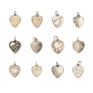 This collection of sterling silver heart charm came to us from a private collection and features something for everyone. Each charm is unique and sweet with enchanting details. Paired with one of our new silver chains, these adorable heart charms can be worn both as a pendant or in a cluster of charms. Front charm view