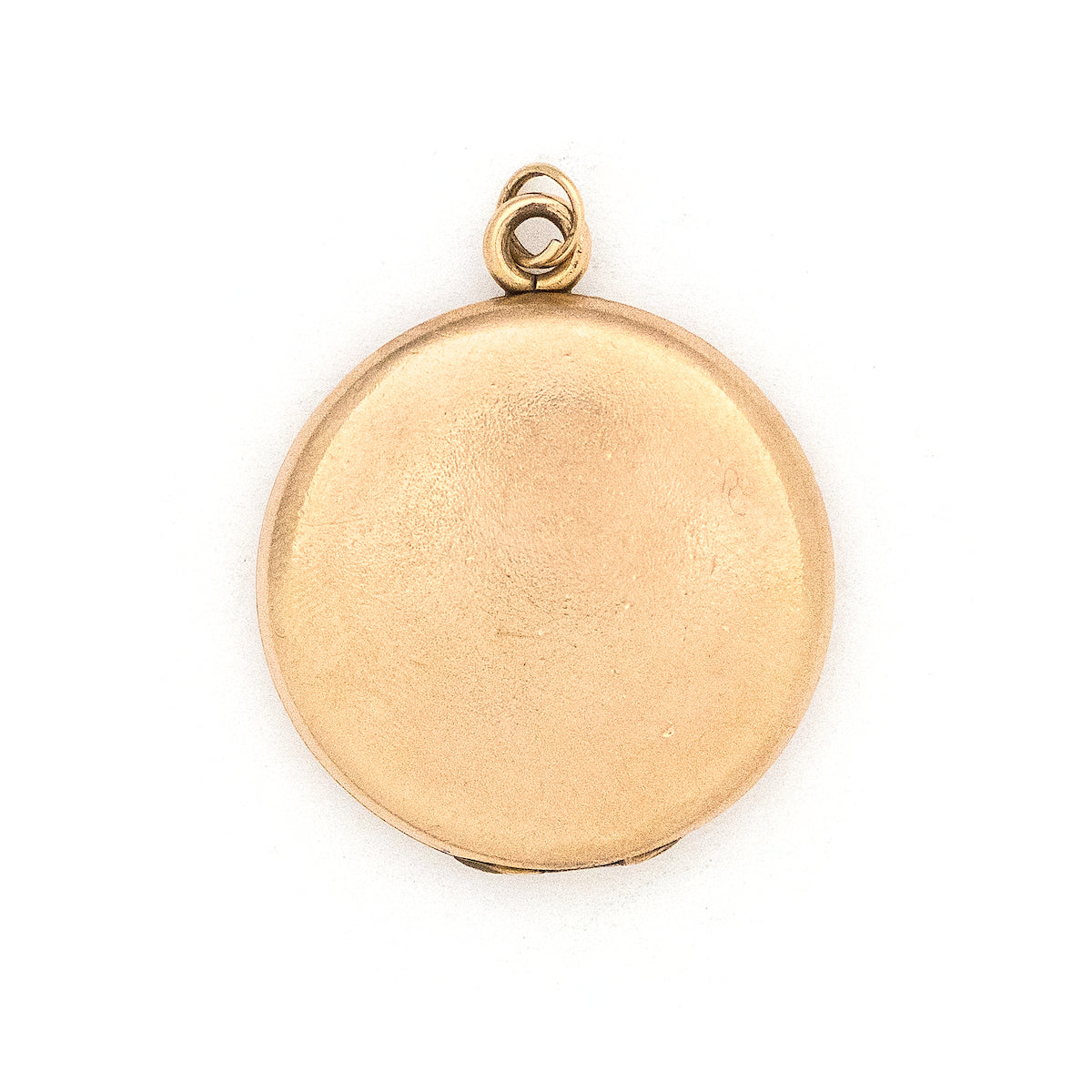 This round locket features a beautifully stylized cursive "G", complete with accenting flourishes. It opens to hold two photos, includes both original frames and pairs perfectly with one of our antique gold fill chains. Back locket view