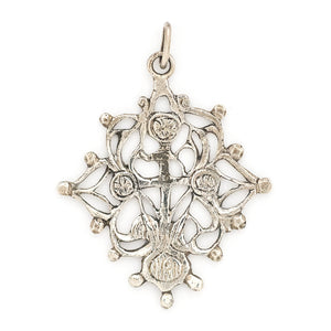 This grand sterling silver pendant features a cross surrounded by ornate vines.  Paired with our antique sterling silver bar link watch chain, this pendant can be worn both as a pendant or in a cluster of charms.  Back charm view
