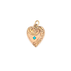 This petite heart shaped charm features turquoise at its center with a raised relief off center design around the edges. "Mother" is lovingly hand-engraved on the back in perfect calligraphy. This meaningful gift for mom pairs perfectly with one of our antique chains. Front charm view