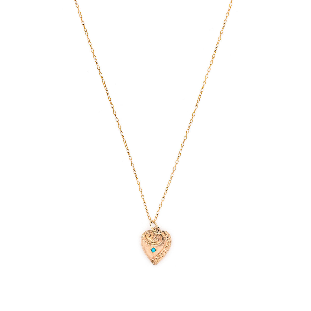 This petite heart shaped charm features turquoise at its center with a raised relief off center design around the edges. "Mother" is lovingly hand-engraved on the back in perfect calligraphy. This meaningful gift for mom pairs perfectly with one of our antique chains. Front charm view