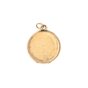 This petite round locket features a simple "M" in Old English script. It opens to hold two photos, includes both original frames and pairs perfectly with one of our antique gold fill chains. Back locket view