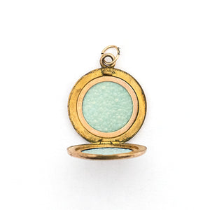 This petite round locket features a simple "M" in Old English script. It opens to hold two photos, includes both original frames and pairs perfectly with one of our antique gold fill chains. Open locket view