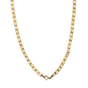 This 12K gold fill Victorian book chain features petite links with delicate etching on the front and back of each link. Measuring 15" long, wear this chain layered with other pieces or simply on its own. Close up chain view